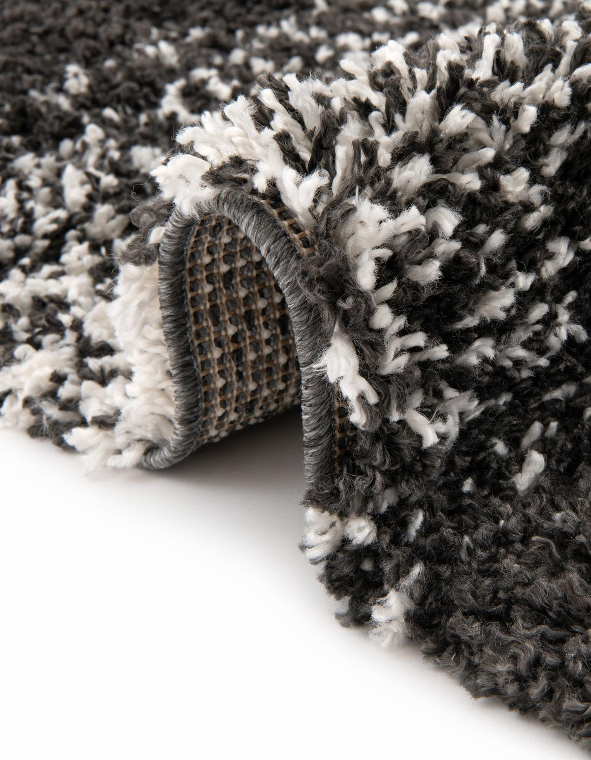 Rund Hochflorteppich Lagom Shag in Schwarz und Weiss von Hadorn™ - Lifestyle Image