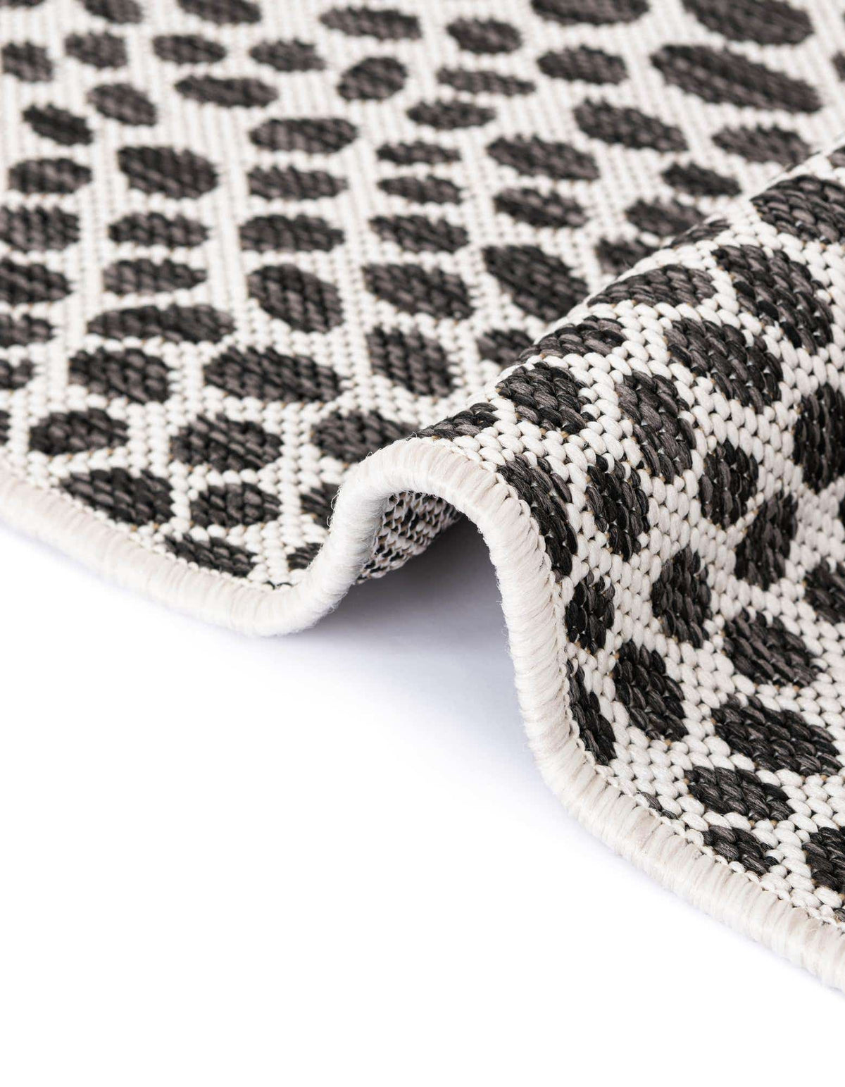 Achteck Outdoor Teppich Tulum Outdoor in Schwarz von Hadorn™ - Lifestyle Image