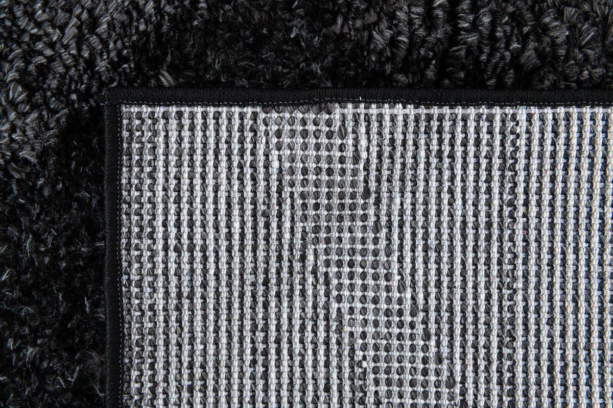 Rechteck Teppich Thun Tribus in Schwarz von Hadorn™ - Lifestyle Image