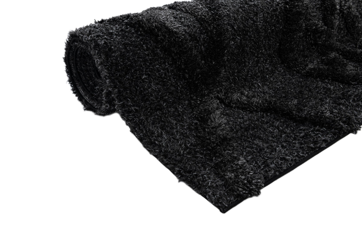 Rechteck Teppich Thun Tribus in Schwarz von Hadorn™ - Lifestyle Image